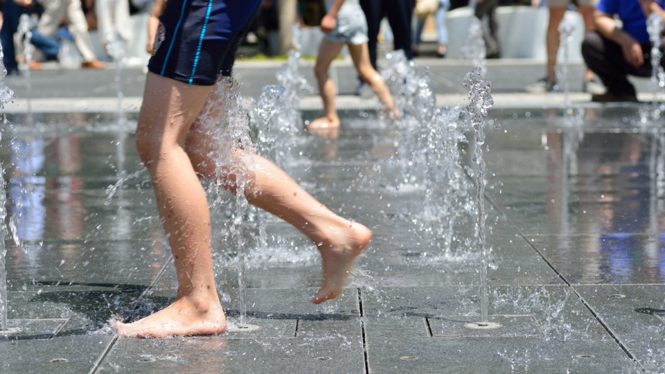 boy playing in splash park