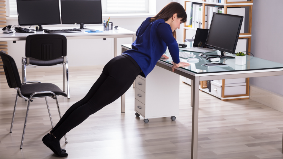 woman doing desk plank