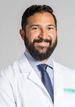 V. Karlos Arcos, M.D.