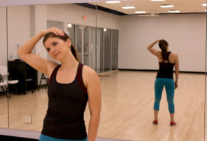 Girl standing and stretching neck