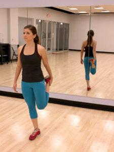 Girl stretching her quadriceps